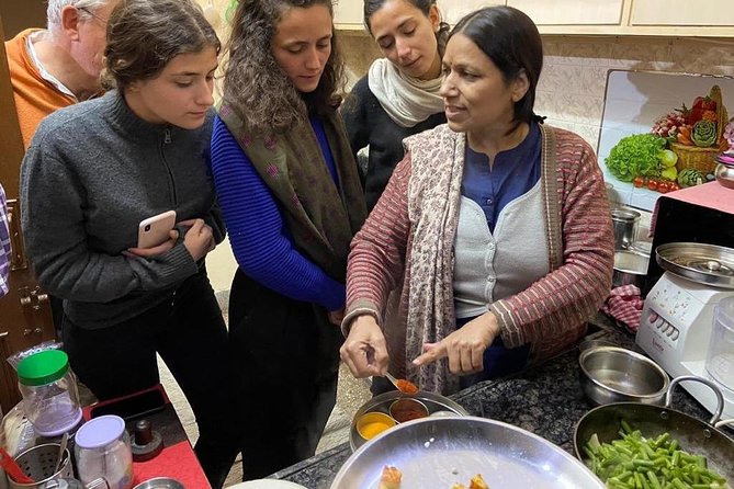 Cooking Class in Jaipur – Family Experience with Meal & Transport - Cooking Indian food inside a Jaipur family home